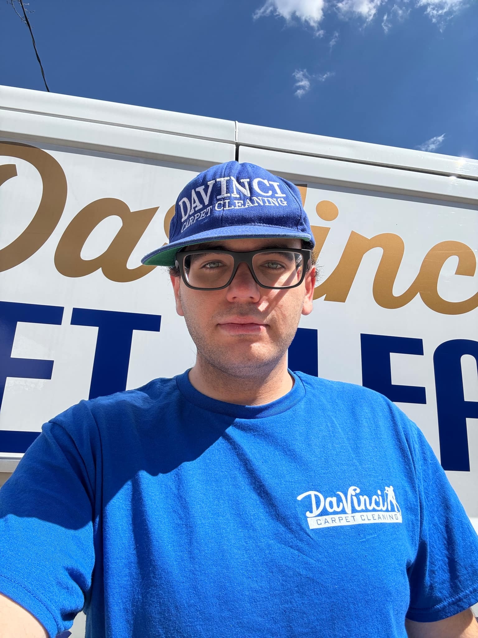 Dryer vent cleaning service in Brooklyn NY with DaVinci Carpet Cleaning technician in front of service van.